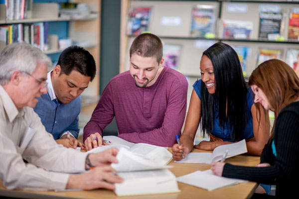 Group of teachers working on papers